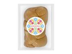 Braided cheese in clear packaging with a colorful folk-art inspired label featuring flowers and wheat.