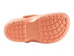 Bottom view of a single peach-colored children's clog with a textured sole.