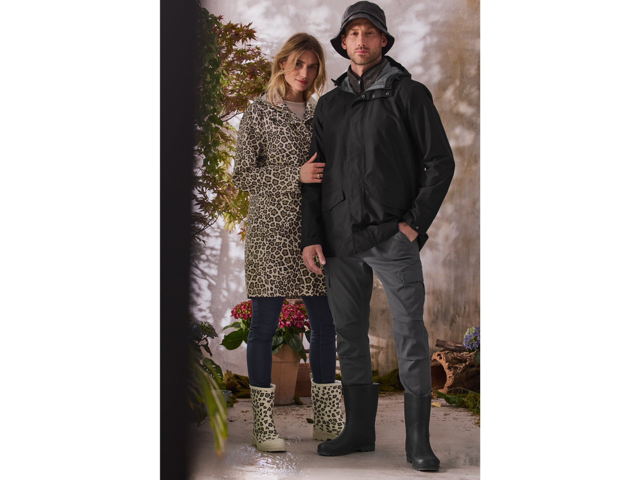 Couple in stylish raincoats and leopard-print rain boots.
