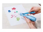 Hands holding a Crelano airbrush pen, creating colorful sea-themed designs on paper.