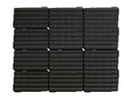 Multiple black pegboards with white dots and slots, stacked and arranged in a grid.