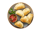 Empanadas and salsa on a plate.