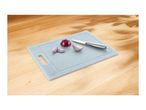 Light blue cutting board with a knife and sliced red onion on a wooden surface.