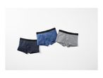 Three men's boxer briefs in navy, blue, and grey, arranged diagonally on a white background.