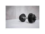 Black dumbbells with weights in a gym.