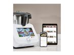 A white Monsieur Cuisine Smart food processor with a screen displaying recipes, next to a tablet and smartphone showing recipe apps.