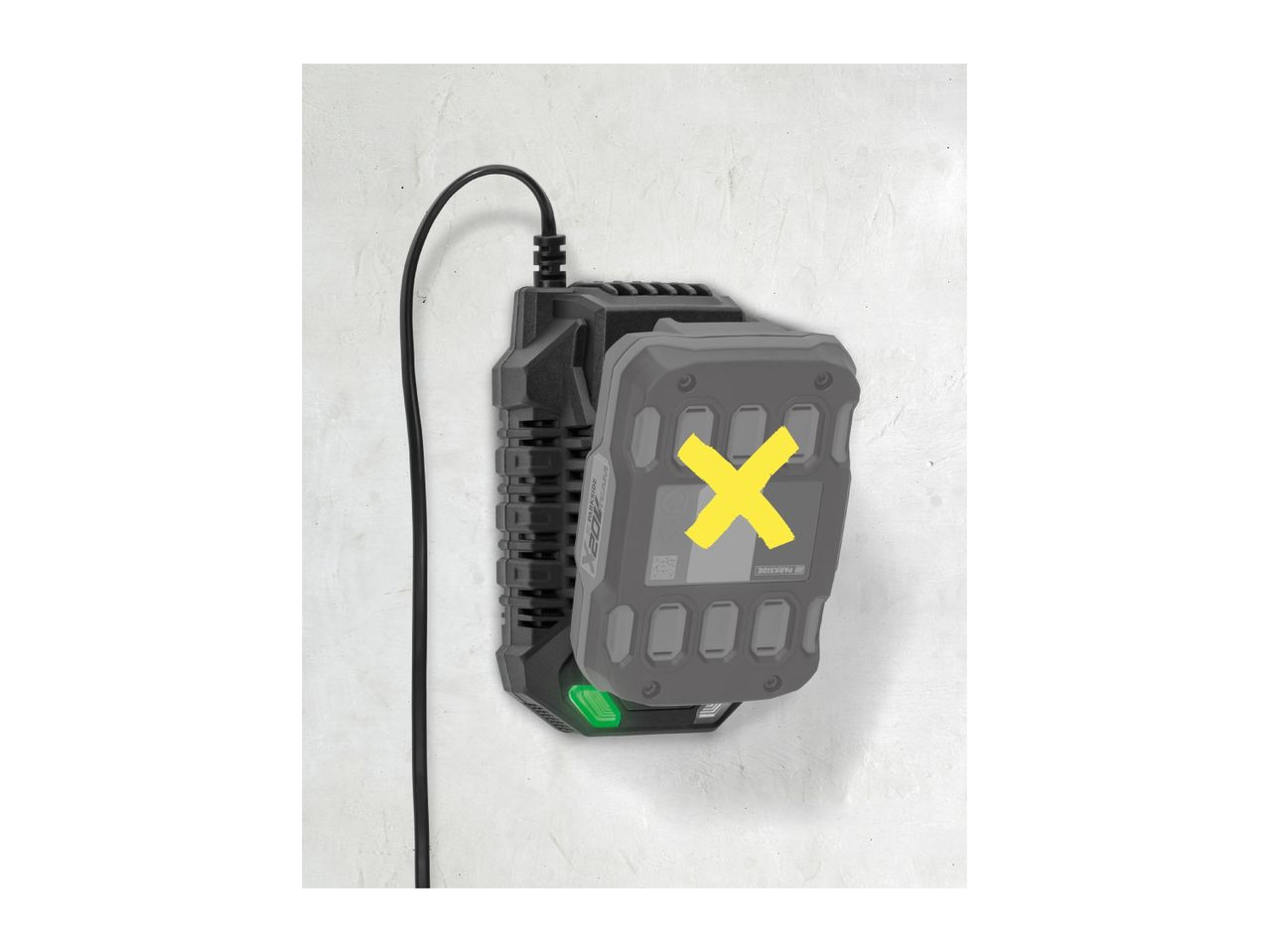 A power tool battery charger with a battery attached, mounted on a wall.