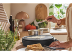 A person making crepes on a SILVERCREST® Crêpe Maker.