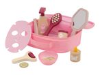 A pink toy spa set with a face mask, brush, mirror, and other beauty accessories.
