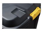 Close-up of a black plastic storage box with a yellow latch.