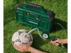 Parkside® Portable Compressor PMK 1100 A1 inflating a football on grass.