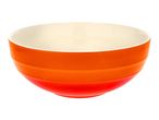 An orange ceramic bowl with a white interior, featuring a subtle gradient from orange to red.