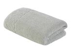 A rolled-up, light gray bath towel.