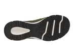 Bottom view of a green and black athletic shoe with a textured sole.