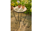 Garden side table with mosaic top and two potted plants on a patio.
