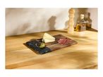 Cheese, capers, and cured meat on a wooden and marble serving board.