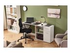 Home office with white desk, black office chair, and a white bookshelf against a green wall.