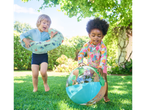 Children playing with a floatie and beach ball in the garden.