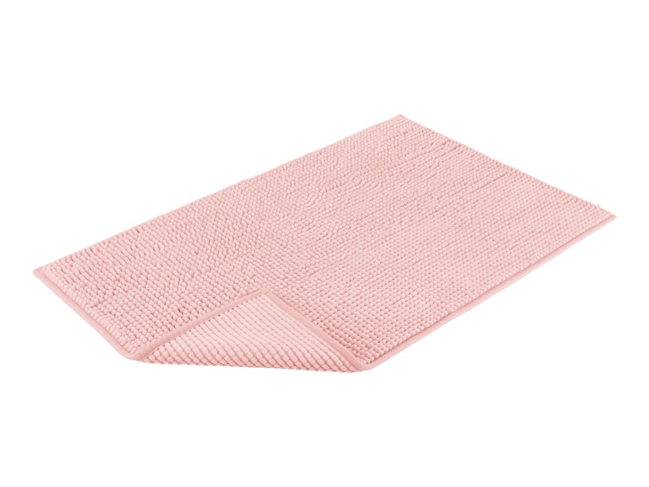 A pink bath mat is shown, folded slightly to display its texture.