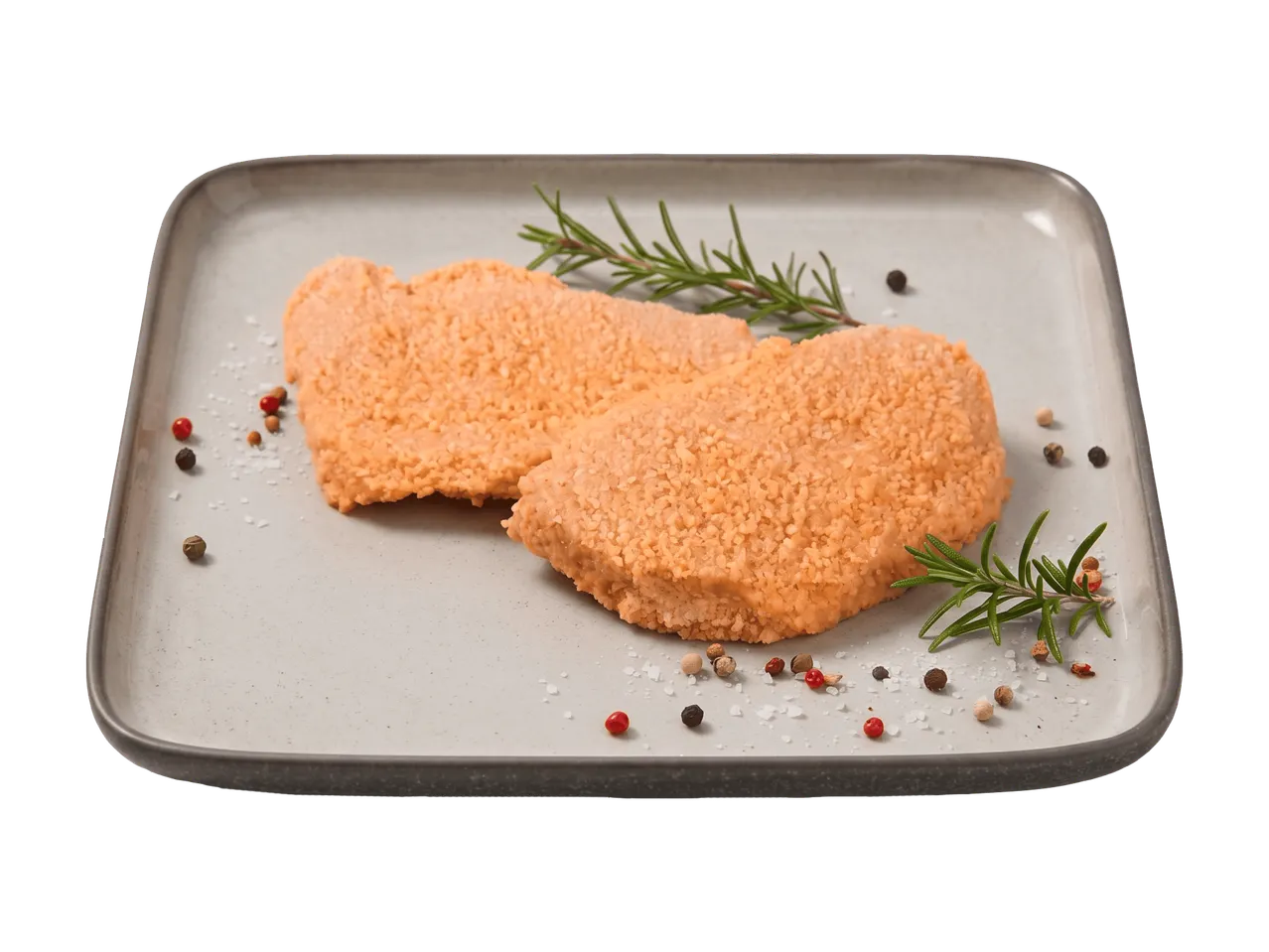 Zwei panierte Schnitzel auf einem Teller mit Rosmarin und Gewürzen.