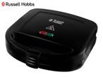 Black sandwich maker with red and green indicator lights and a hot surface warning symbol.