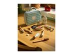 A wooden toy dentist set with a light blue bag, mouthwash, toothpaste, and dental tools on a wooden table.
