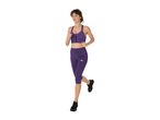 Woman in purple sports bra and capri leggings running