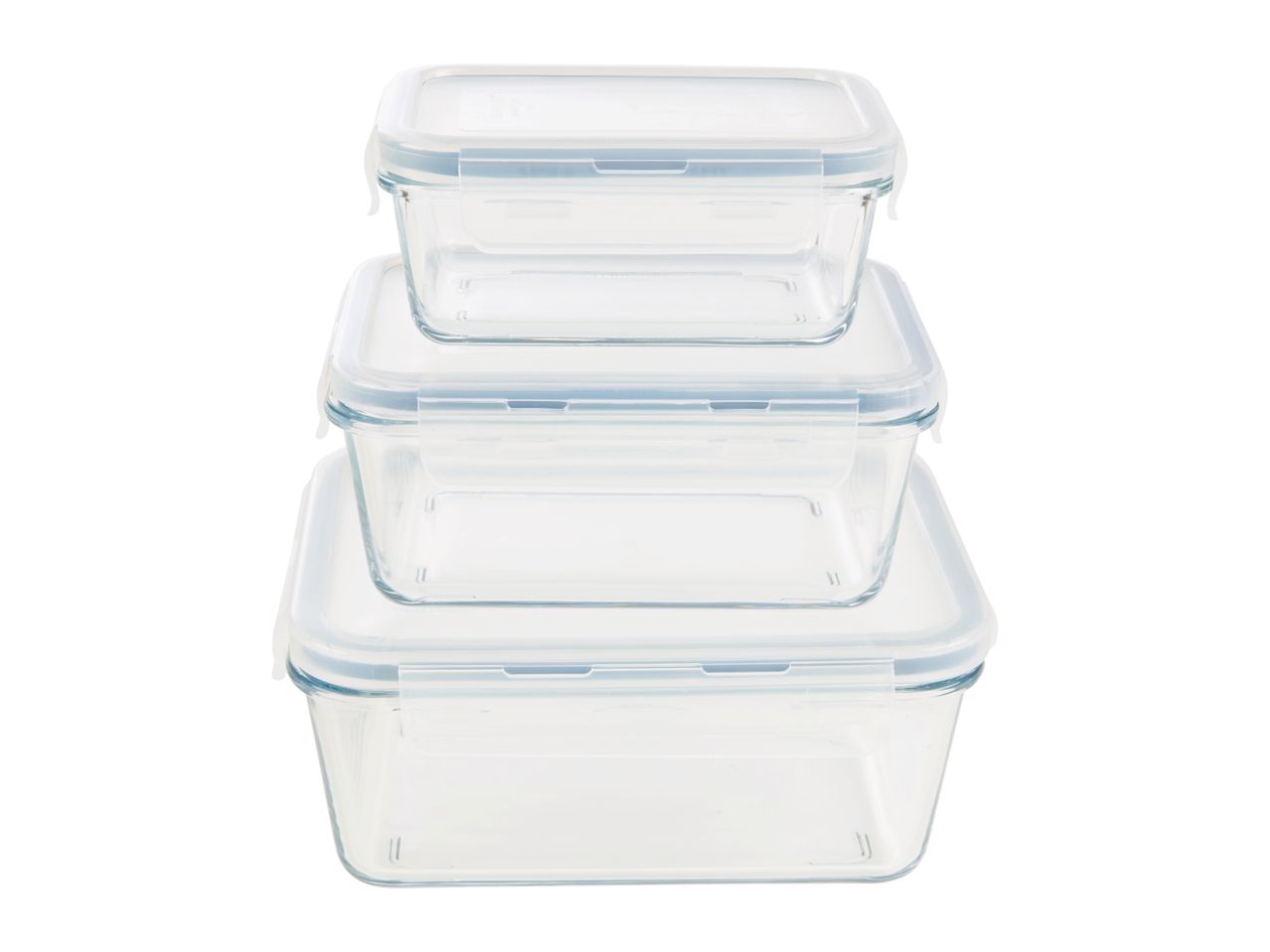 Three clear glass food storage containers with white lids, stacked from smallest to largest.