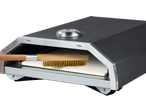 Grillmeister pizza oven with a cleaning brush and pizza stone inside