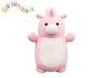 Pink unicorn plush toy with a white belly and a colorful arched text above it.