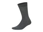 A single dark gray sock standing upright.