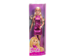 Barbie doll in a pink metallic dress with a heart cutout, in its packaging.
