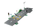 A Lego road plate with traffic lights, streetlights, and road signs.