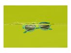 Green sunglasses partially submerged in water with splashes against a lime green background.