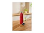 Red stainless steel water bottle with its cap off on a wooden table