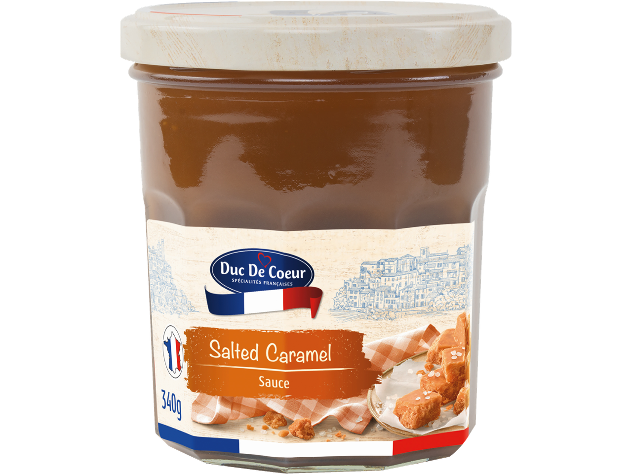 Jar of salted caramel sauce with a French-themed label and caramel pieces.