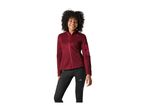 Smiling woman in a red fleece jacket and black sports leggings