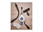 Handheld steam cleaner with various attachments, including a hose, brushes, and measuring cup.
