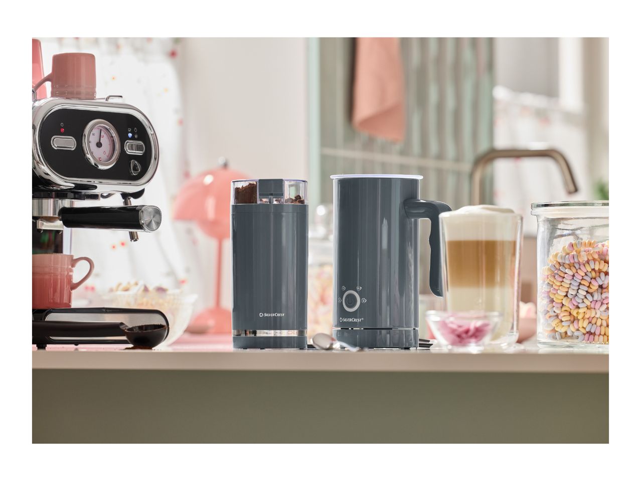 SilverCrest coffee machine, grinder, and milk frother on a kitchen counter.