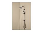 Black shower system with a rainfall showerhead and a handheld shower, water spraying
