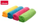 Four colorful rolled-up microfiber cleaning cloths in yellow, blue, pink, and green.
