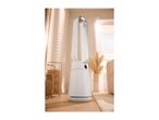 White bladeless fan in a bright living room with wooden floors and natural light.