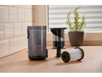 SILVERCREST® Cordless Cyclone Handheld Vacuum Cleaner dust container and filters on a wooden surface.