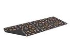Black kitchen runner with a pattern of mushrooms, ferns, and autumn leaves.