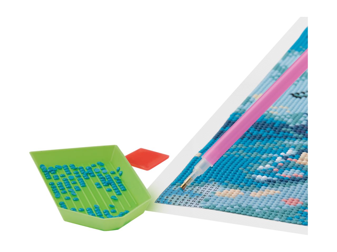 Diamond painting kit with a green tray of blue diamonds, a pink pen, and a red wax square.
