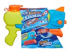 A green and blue water blaster in packaging, with text 'Super Soaker' and 'Wave Spray'.
