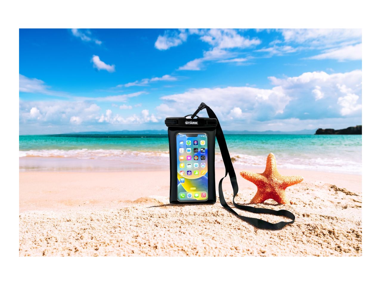 Waterproof phone case with a smartphone and a starfish on a sandy beach.