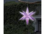 LIVARNO home Inflatable LED Christmas Star hanging from a branch outside a house