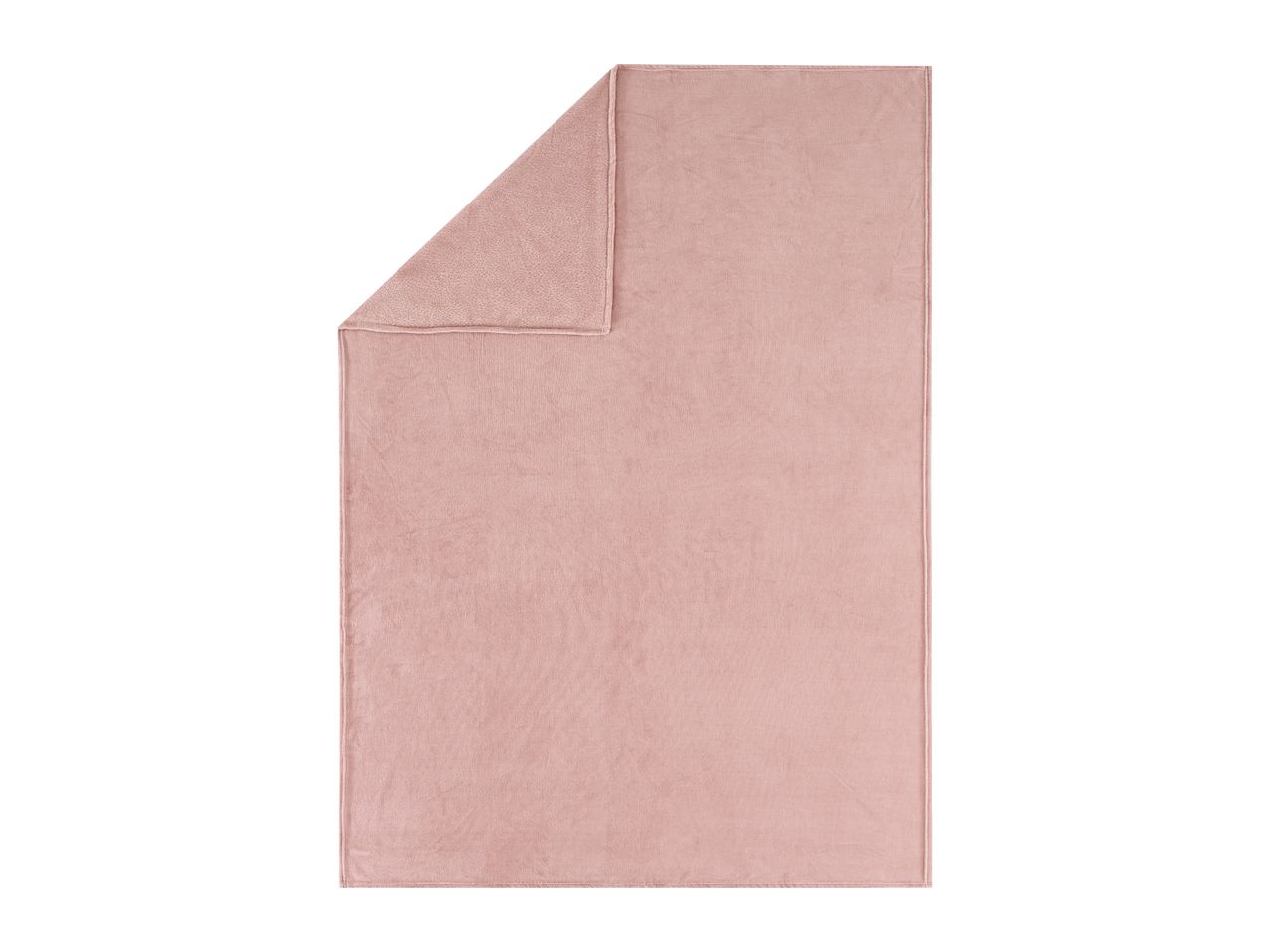 Soft pink fleece blanket with a folded corner