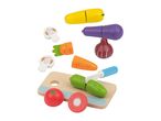 Wooden toy vegetables including corn, eggplant, onion, carrots, mushrooms, cucumber, tomato, and a cutting board with a knife.